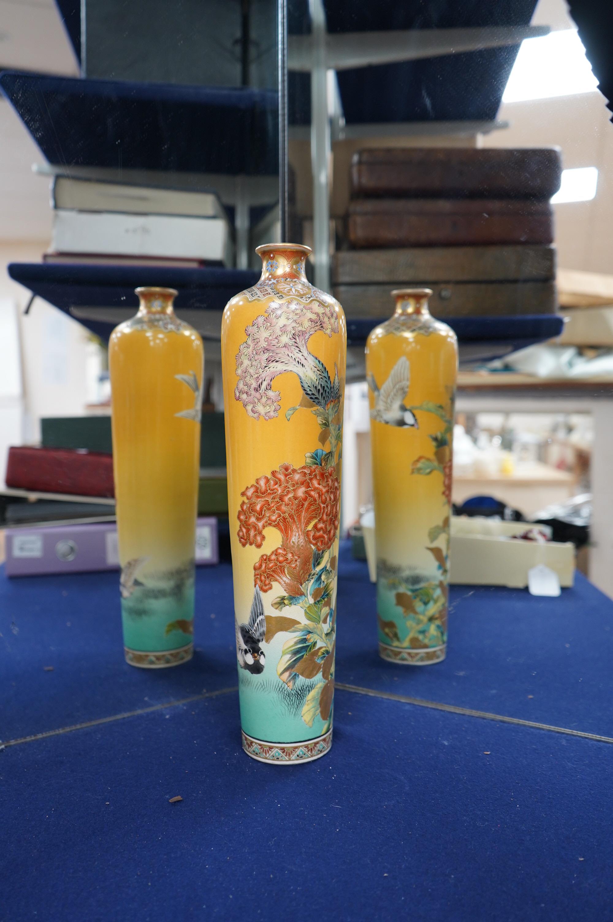 A Japanese Satsuma tall vase, Meiji period, by Taizan Yohei III, decorated with birds and blossom on a yellow ground, signed, 37cm high. Condition - hairline crack, otherwise good condition